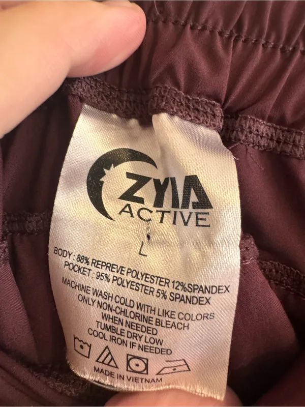ZYIA Women's Deep Plum Athletic Shorts with Zip Pockets - Image 2