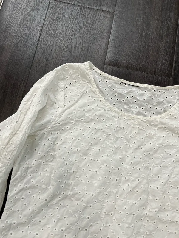 Lightweight white eyelet top with a scoop neckline and three-quarter sleeves - Image 2
