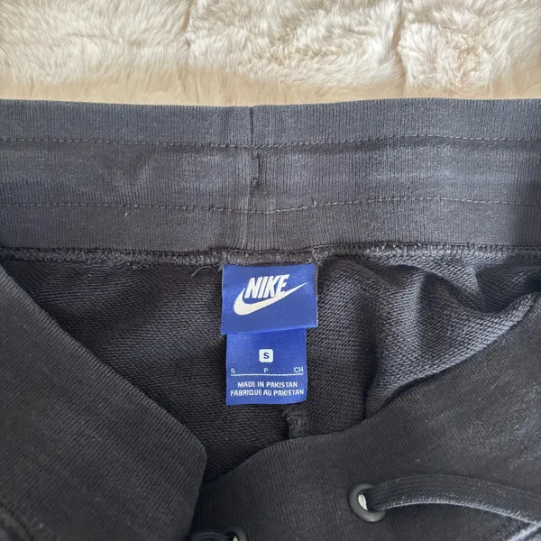 Black Nike sweatpants with drawstring waist and adjustable cuffs - Image 5