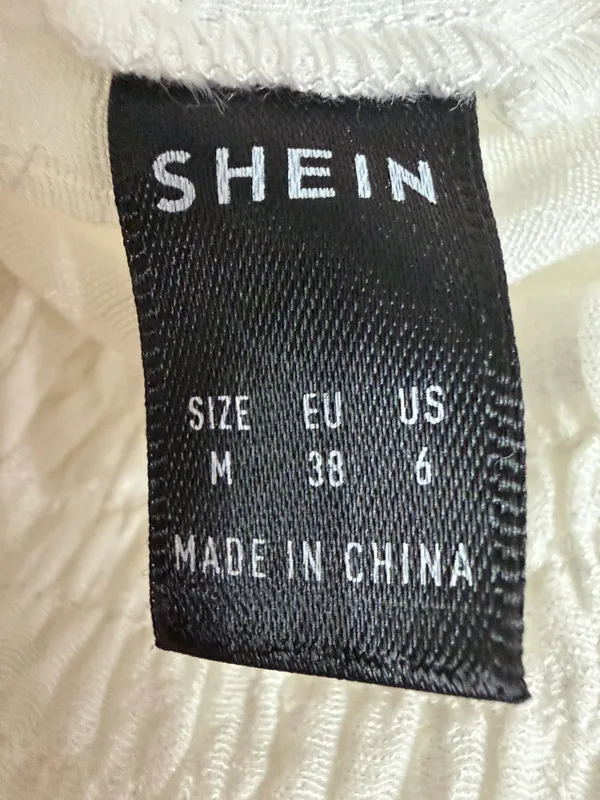 SHEIN tiered ruffle mini skirt smocked high waistband - Size Medium. ***Refer to measurements. Super cute skirt. Gently warn & excellent condition. Goes with anything. Does not include underneath shorts. Measurements approximately 12.5” waste x 17” long. Non-smoking home. Priced at as is condition. Don’t like my price make a reasonable offer! And thank you for checking my closet! - Image 3