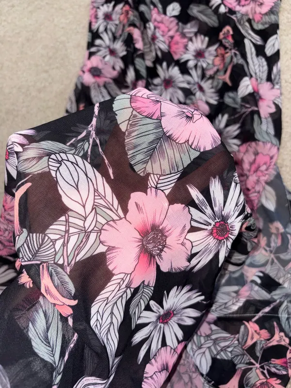 Flowy maxi Serong with an all-over pink floral pattern. Tie-waist detail for a customizable fit. Lightweight, breezy fabric for beach or pool wear. Feminine floral design ideal for vacation days. - Image 2
