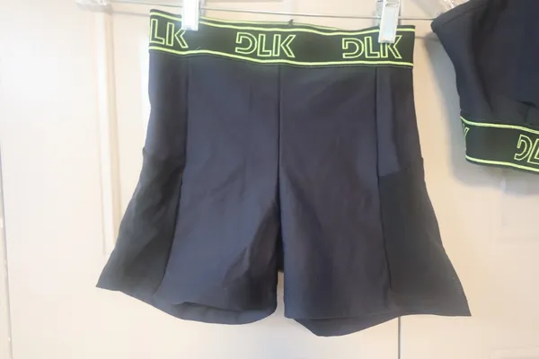 DLK Workout exercise loungewear casual summer active shorts and one should top sports bra set in black and lime green - Image 5