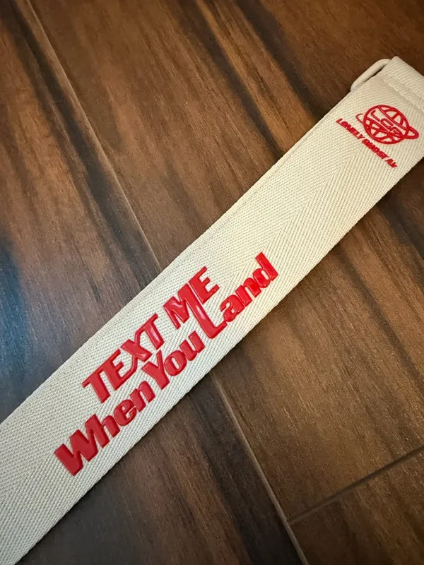 BEIS Lonely Ghost “Text Me When You Land” beige Travel Bag Strap with Red Text - Image 2