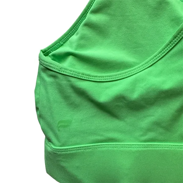 Fabletics Siena High Impact Sports Bra in Green XS Product Description Your favorite high-support sports bra is now updated with a higher neck and wider bottom band for even more coverage. It's also built with perforated details for supreme cooling capabilities. Features 4-Way Stretch Fabric Knit 81% Nylon/19% Elastane Imported by Fabletics GmbH, Bergmannstraße 102/103, 10961 Berlin - Image 6