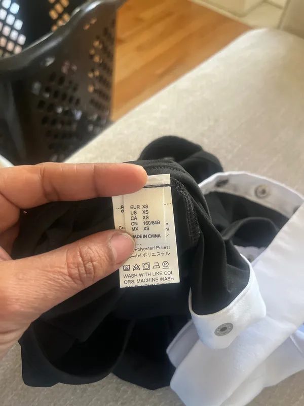 Seatyrocks Elevate your style with this chie black and white bodysuit. Perfect for any occasion, it features a sophisticated button- up design - Image 7