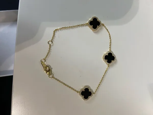 Black and gold clover necklace, bracelet and earrings set - Image 2
