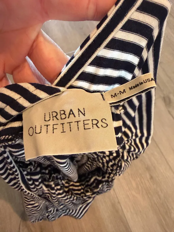 Urban Outfitters Striped Romper - Excellent Condition - Women’s Size M Description: Upgrade your casual wardrobe with this effortless Urban Outfitters striped knit romper! Made in the USA, this stylish piece features a classic navy and white nautical stripe pattern with a flattering deep V-neckline, soft cap sleeves, and a comfortable cinched elastic waistband. Crafted from a soft, lightweight stretch fabric, it’s perfect for summer outings, beach cover-ups, or casual weekend wear. Brand: Urban Outfitters Size: Women’s Medium (M) Condition: Excellent, like-new condition with no visible flaws, stains, or excessive wear. Details: Elasticized waist, short inseam, breathable stretch material, made in USA. Fast shipping from a smoke-free home! Feel free to drop a comment with any questions or send reasonable offers. - Image 4