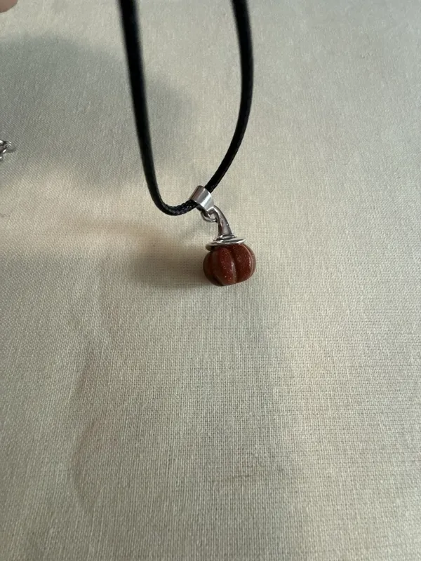 Goldstone Pumpkin Pendant Necklace on Black Cord - Image 2