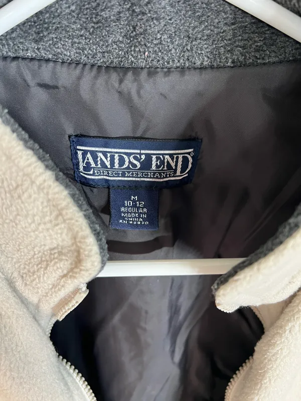Warm sleeveless fleece vest with contrasting side panels. Full zip front for easy wear. Zippered pockets secure small items. Simple, versatile layer for cool days. Land’s end size medium (10-12) - Image 3