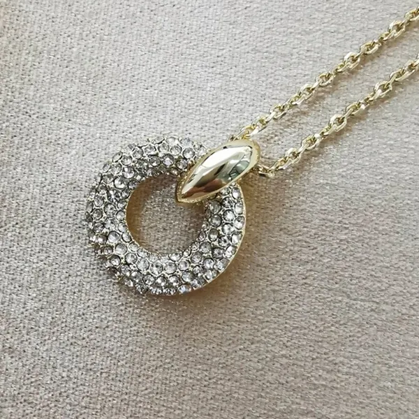 Kendra Scott Mikki Pave Pendant Necklace is a gold-toned necklace - Image 7