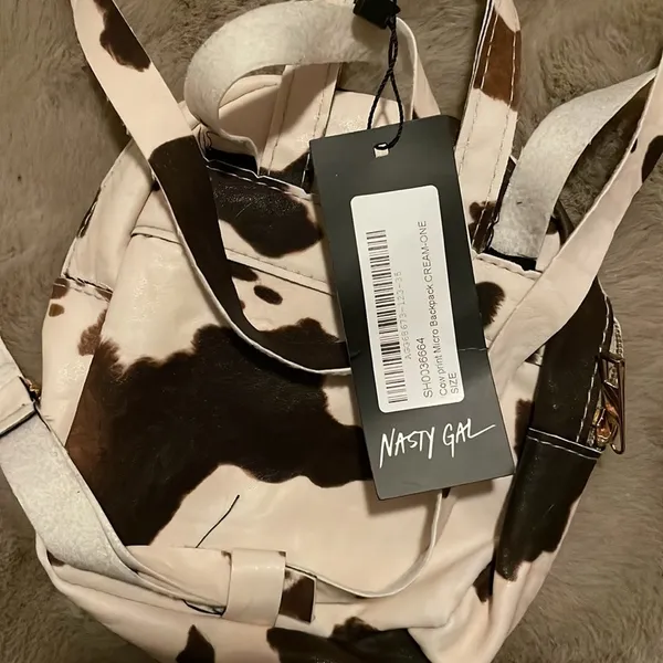 MOVING SALE!! NWT Cow print mini backpack! - Image 3