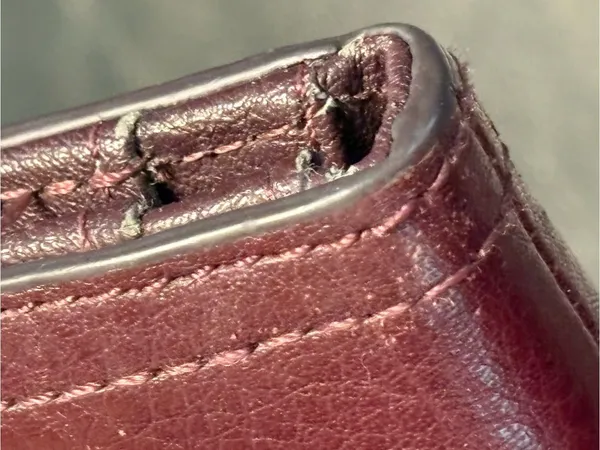 Fossil pebbled leather tab clutch wallet in a deep burgundy or berry color - Image 4