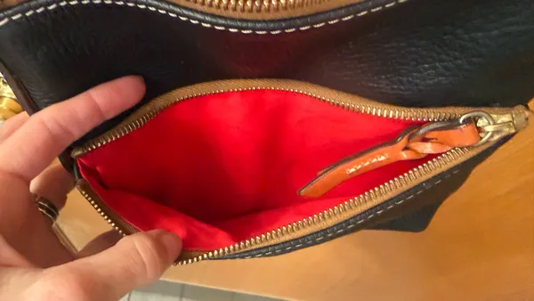 This is a Dooney & Bourke black pebbled leather crossbody - Image 7