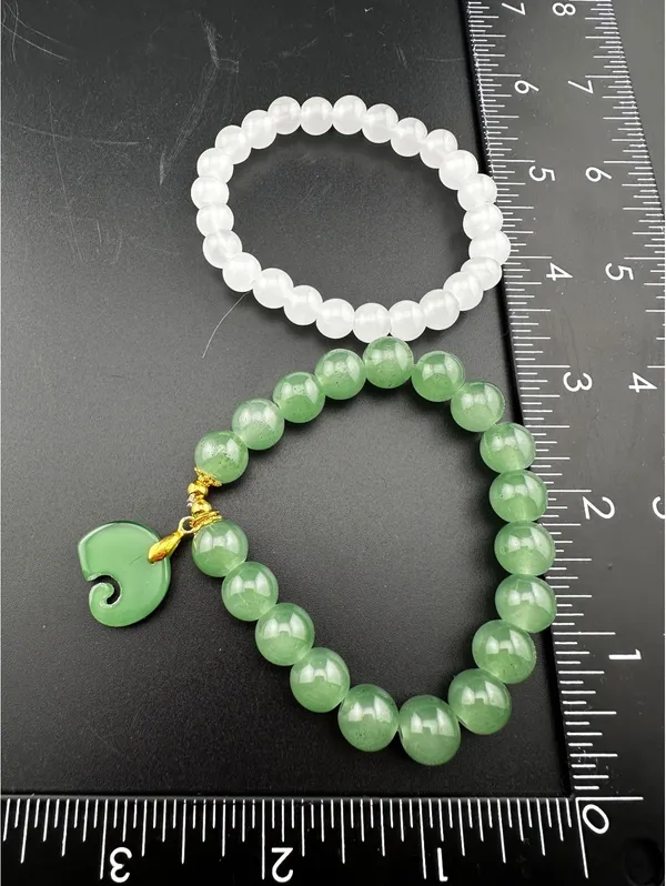 Set of Two Green and White Beaded Bracelets with Green Charm - Image 2