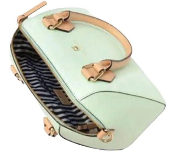 Kate Spade NEW YORK-MINT MOJITO PIPPA PARNELL STREET LEATHER SATCHEL Perfect spring bag, mint green white tan handle and crossbody strap, top zip closure, stripe print interior, inside zip pocket, inside two open pockets, amazing condition, there are two call outs, a small smudge on the bottom of the bag and a small smudge on one corner, please see the last two pictures **This bag is preowned and is being sold as is** - Image 3