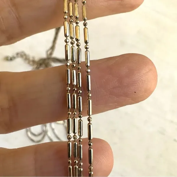 Long gold tone double chain small leaf pendant - Image 8