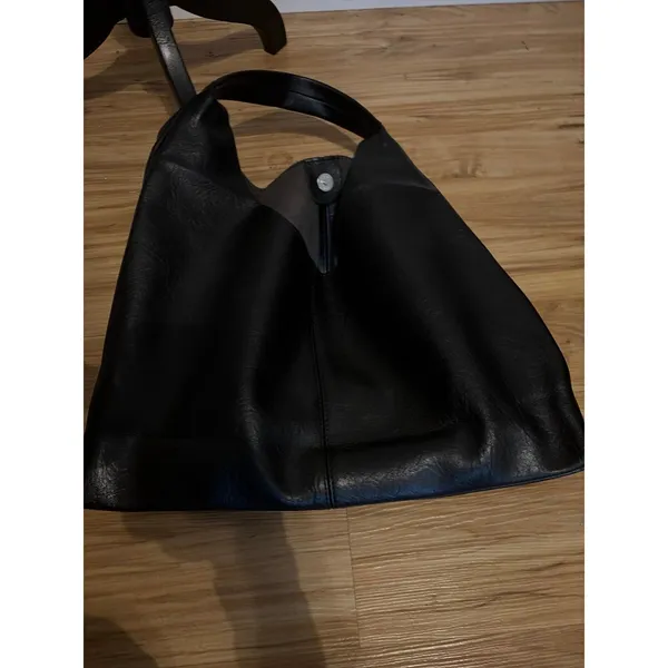 Black slouchy vegan leather shoulder bag with an unstructured, triangular hobo d - Image 2