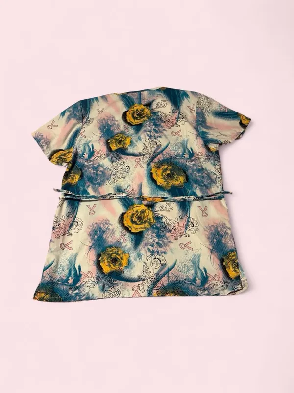 Floral Short Sleeve Wrap-Style Scrub Top in Blue & Yellow with pink ribbons - Image 2