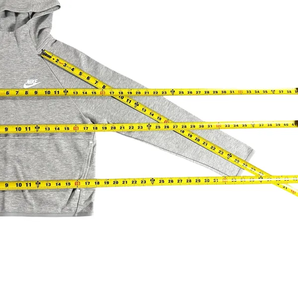Nike Gray Minimalist Hoodie XS Y2K Athleisure Streetwear Description: Soft gray Nike hoodie with embroidered logo and kangaroo pocket. Perfect minimalist, gorpcore, streetwear, gym, and casual layering essential. Pre-owned Condition: Excellent Flaws: No significant flaws observed. Stored: Model created by AI. NikeHoodie Streetwear Athleisure MinimalistStyle Gorpcore HeatherGray Pullover LogoHoodie Layering Y2K - Image 6