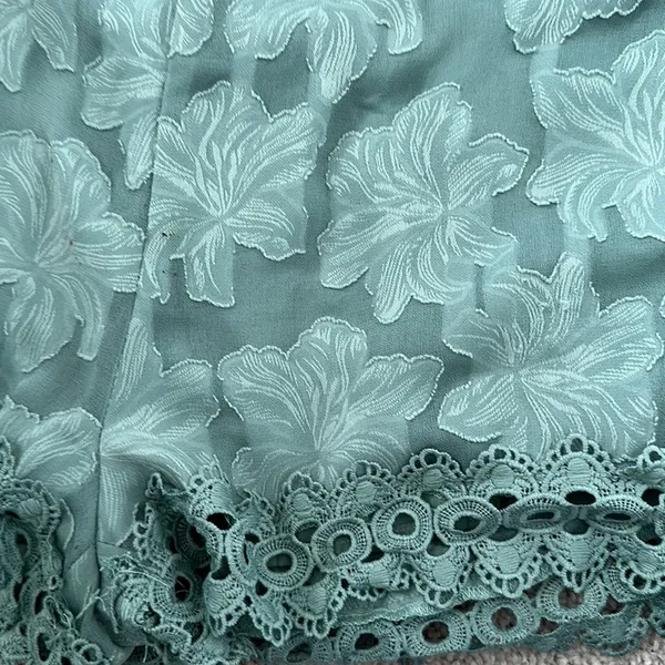 Sage green dressy shorts with lace trim - Image 2