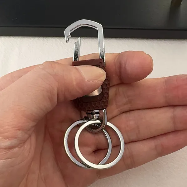 Practical carabiner keychain designed for both men and women for everyday carrying needs. Comes with double key rings, allowing you to classify and organize different keys separately. This keychain is 2.5 inches in length and 0.9 inches in width, compact and portable to carry around. Suitable for car keys, home keys, small gadgets, backpacks and handbags for convenient hanging. Simple versatile style matches various scenarios, a nice daily accessory and casual small gift. - Image 6