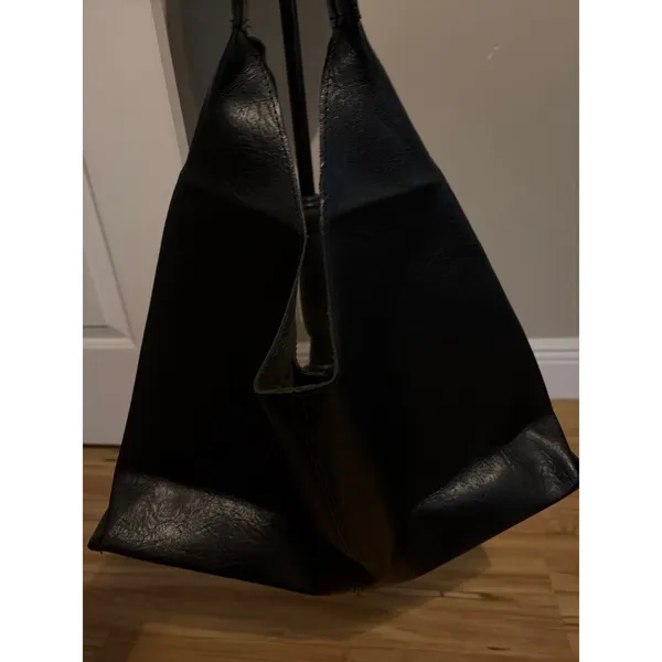 Black slouchy vegan leather shoulder bag with an unstructured, triangular hobo d - Image 5