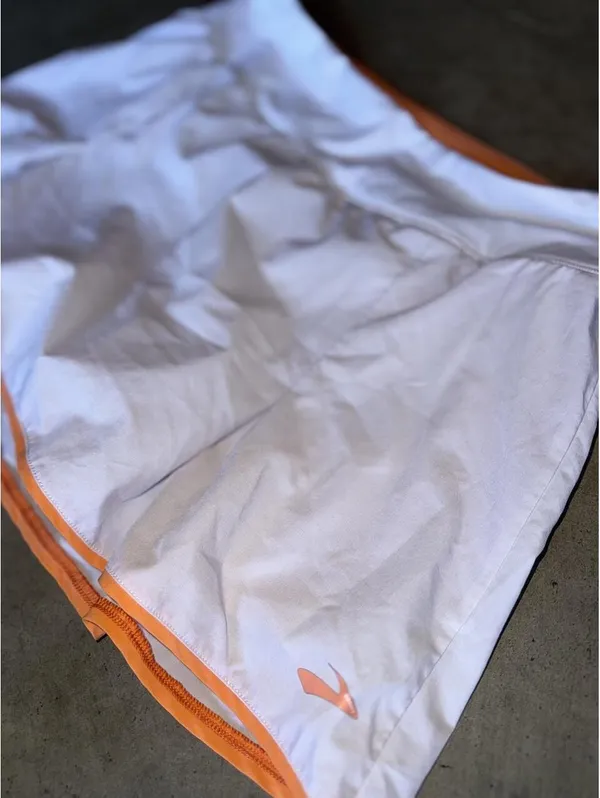 white and orange Brooks Chaser Skort - Image 2