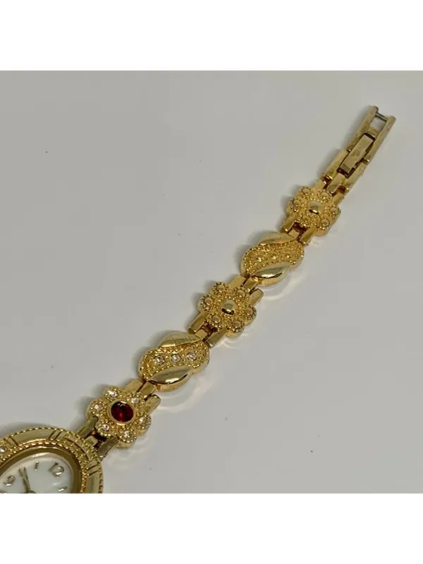 Allude gold tone women’s watch red stones 19mm floral links up to 7.5” running - Image 4