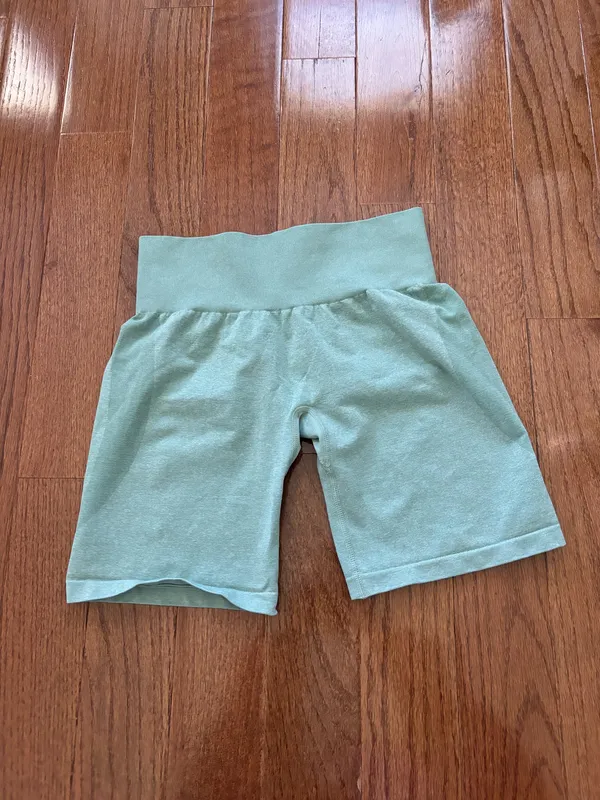 NVGTN Sage Green Contour Seamless Shorts M bike shorts lightly worn Our signature seamless material is now available in shorts! These shorts feature a conservative length that won’t be interrupted through movement along with a form flattering waistband that offers slight compression. This buttery soft and breathable material will not only feel weightless on your body, but will move with and not against you. Pair these with its matching seamless top or bra to complete the look. - Nylon and spandex - Fabric feels… lightweight, soft, stretchy - High waisted - Compressive waistband contour shaping - Image 3