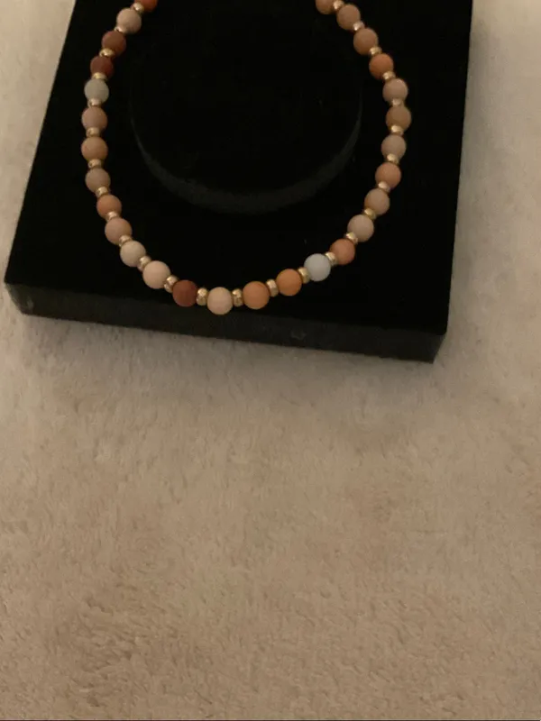 Neutral Multi-Bead Stretch Bracelet with Gold Cross Charm - Image 4
