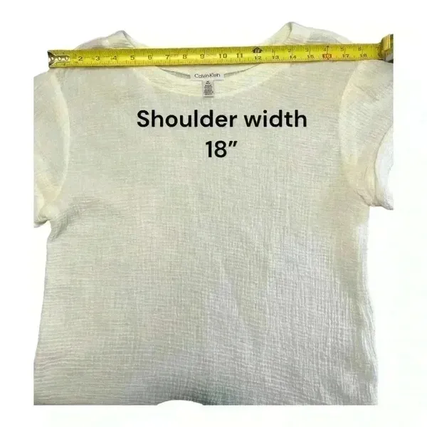 Calvin Klein women’s rolled cuff short sleeve top. Size Medium. - Image 9