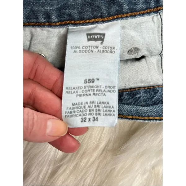 Levi’s 559 Relaxed Cut From Mens Jeans Faded Blue Denim Cut Offs - Image 4