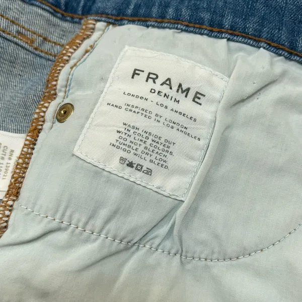 FRAME Denim Le Cutoff Distressed Raw Hem Denim Shorts - Image 6