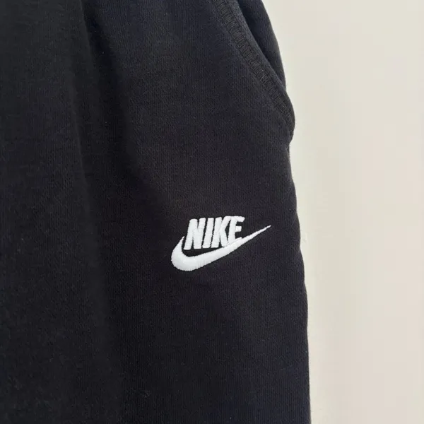Black Nike sweatpants with drawstring waist and adjustable cuffs - Image 3