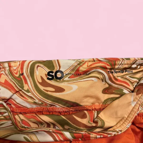 Orange and multi-coloured swirl print shorts with elastic waistband and drawstring - Image 3
