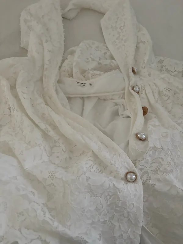 peekskill brand Chic Zimmermann mini dress in cream lace. Features a halter neckline and button details. Ideal for elegant occasions - Image 3
