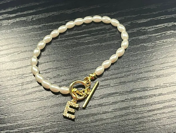 Initial “E” Letter Gold And Pearl Bracelet - Image 2