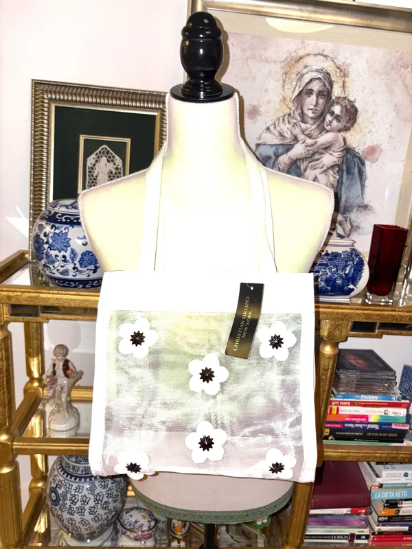 Christian Siriano's elegant translucent mesh tote bag stands out for its delicate black and white floral appliqués. - Image 3