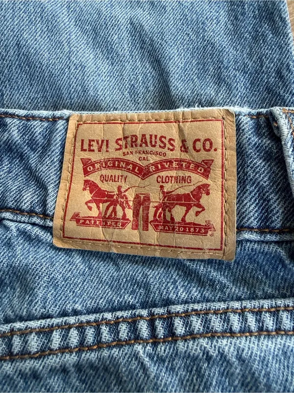 Levi's light blue denim jeans with tan leather patch - Image 3