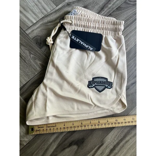 NEW Alphalete Woman’s Varsity Short - Tan ,size Medium - Image 9