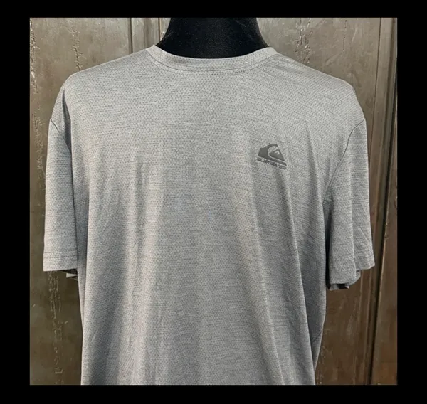 QuikSilver Gray /Charcoal T-shirt - size Large. Gently Warn & in excellent condition. Innovate your future printed on back tail. True color is the ones with measurements. Measurements approximately 22” from armpit to armpit x 26” long. Non-smoking home. priced to sell at as is condition. Don’t like my price, make reasonable offer! And thank you for checking my closet. - Image 3
