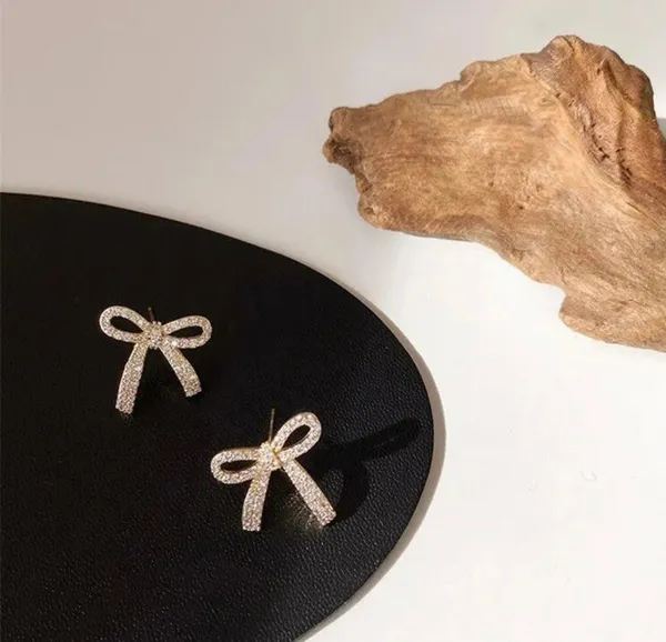 Boutique Gold Sparkly Bow Earring Studs - Image 3