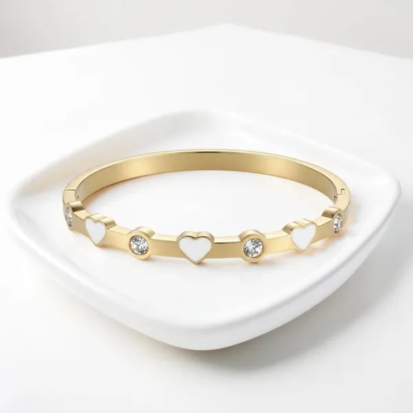 This chic bracelet showcases a beautiful gold finish with delicate white heart d - Image 4