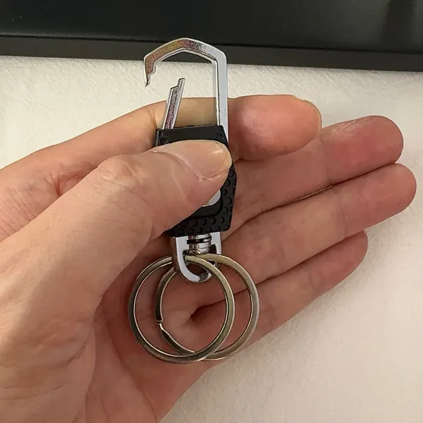 Practical carabiner keychain designed for both men and women for everyday carrying needs. Comes with double key rings, allowing you to classify and organize different keys separately. This keychain is 2.5 inches in length and 0.9 inches in width, compact and portable to carry around. Suitable for car keys, home keys, small gadgets, backpacks and handbags for convenient hanging. Simple versatile style matches various scenarios, a nice daily accessory and casual small gift. - Image 5