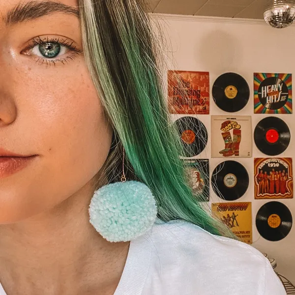 Light Teal Blue Pom Pom Earrings - Image 4