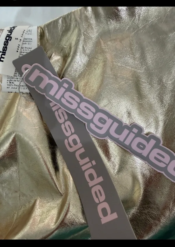Missguided Gold faux leather skirt - size Smal NWT ***Refer to measurements. Beautiful skirt to wear out on a party trip. Fun & spunky. Measurements approximately 15” waste x 14” long. Non- smoking home. priced to sell at as is condition. Don’t like my price, make reasonable offer! And thank you for checking my closet. - Image 4