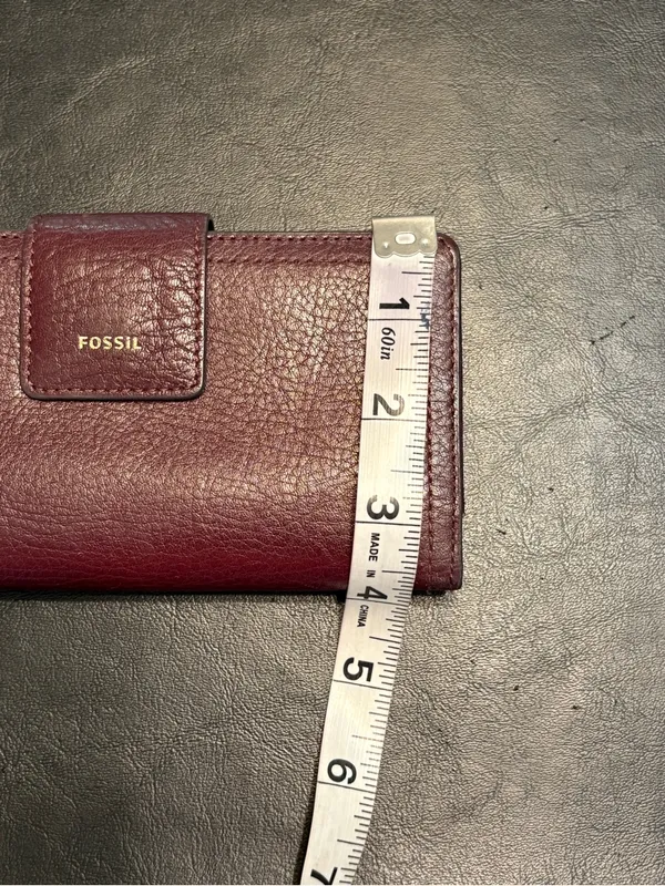 Fossil pebbled leather tab clutch wallet in a deep burgundy or berry color - Image 12