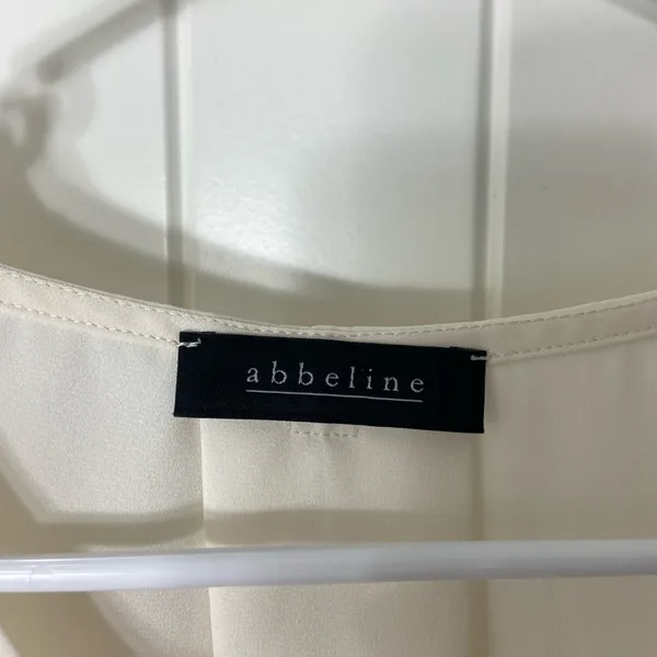 Abbeline women’s solid white elastic‎ cuff crossover high low relaxed blouse XS - Image 3
