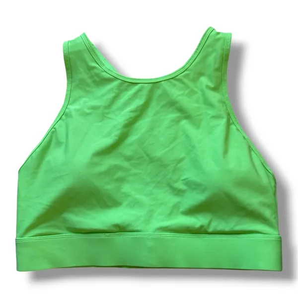 Fabletics Siena High Impact Sports Bra in Green XS Product Description Your favorite high-support sports bra is now updated with a higher neck and wider bottom band for even more coverage. It's also built with perforated details for supreme cooling capabilities. Features 4-Way Stretch Fabric Knit 81% Nylon/19% Elastane Imported by Fabletics GmbH, Bergmannstraße 102/103, 10961 Berlin - Image 4
