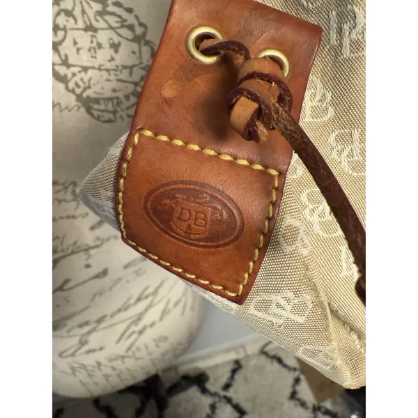 Dooney and Bourke Beige Canvas and Leather Signature Tassel Tote Handbag‎ - Image 4